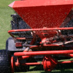 Red lawn spreader