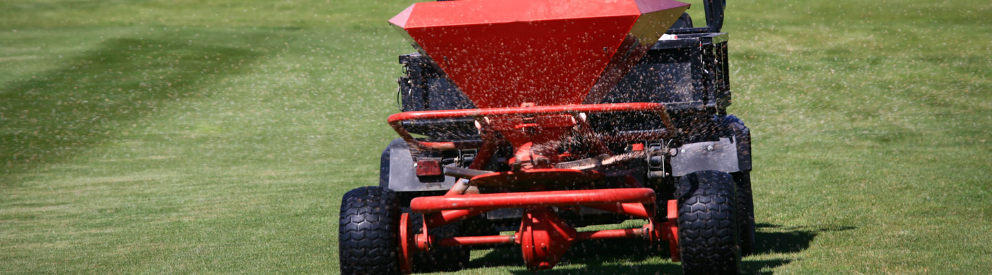 Red lawn spreader